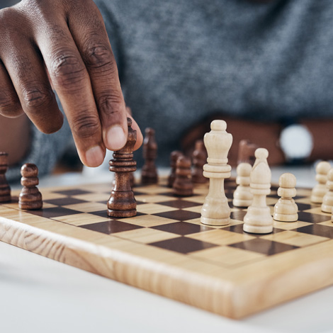 Businessman playing chess