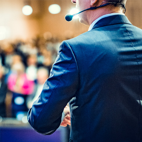 Man speaking at a conference