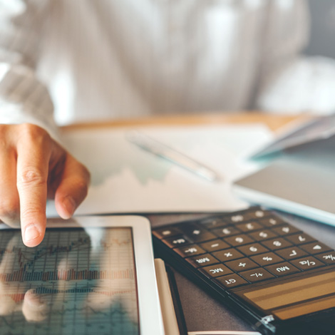 business man using tablet and calculator