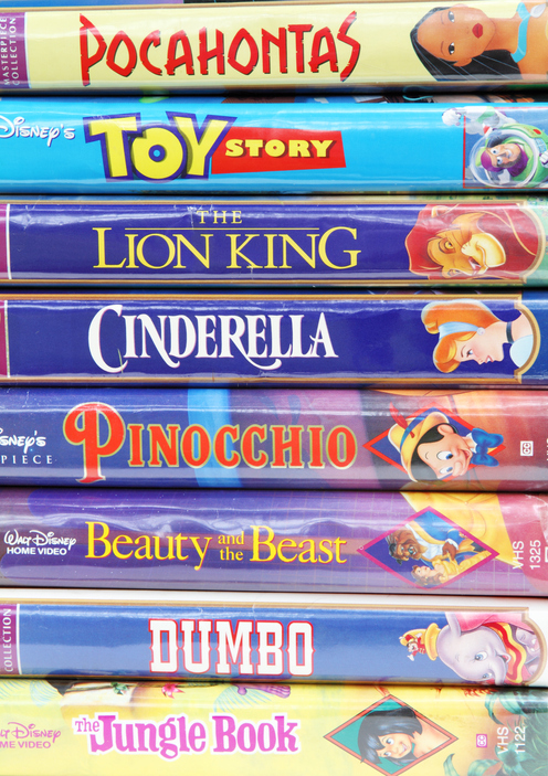 West Palm Beach, USA - August 29, 2011: A collection of Disney vintage VHS tapes, including such popular movie animations as The Lion King, Toy Story, Dumbo, Cinderella, Beauty and the Beast, Pinocchio and others.