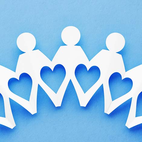 Chain Of People Made of Paper on Blue Background: Unity and Strength Concept paper cutout of people holding hands and heart shape