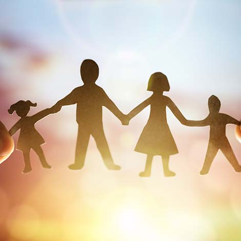 Paper chain family Paper chain family held up to sunset