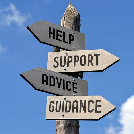 Help, support, advice, guidance signpost wooden street sign with words help, support advice and guidance