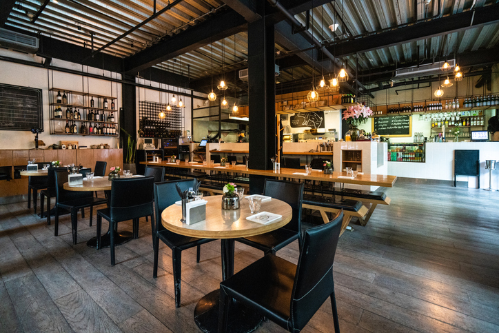 Interior of cozy restaurant for gathering with friends, with tables, chairs, no people