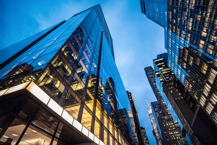 Night view of modern skyscrapers in Midtown Manhattan.