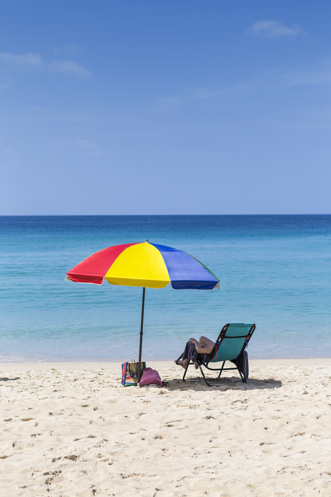Relaxing on the beach, summer break, vacation time, colorful umbrella on beautiful beach, summer outdoor day light