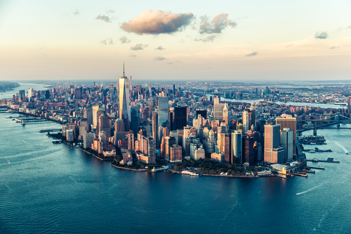 Image of the Manhattan skyline at sunset from an elevated angle.