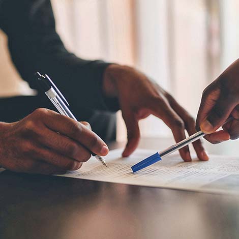 hands completing paperwork