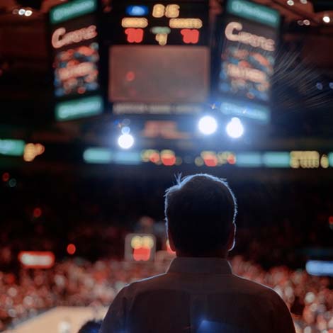 Backlit Man Watching Sporting Event - New York City