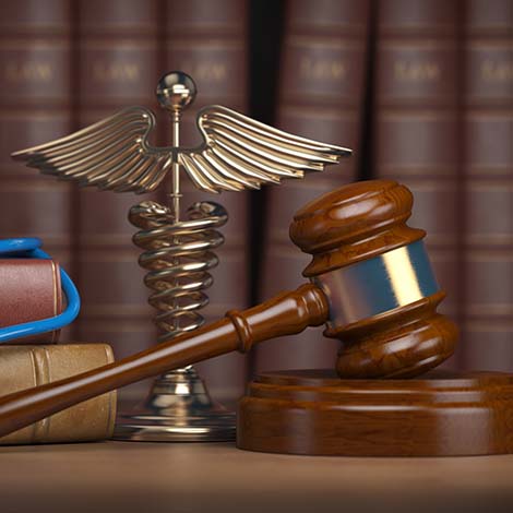 Gavel, stethoscope and caduceus sign on books background. Mediicine laws and legal, medical jurisprudence. Gavel, stethoscope and caduceus sign on books background. Mediicine laws and legal, medical jurisprudence. 3d illustration