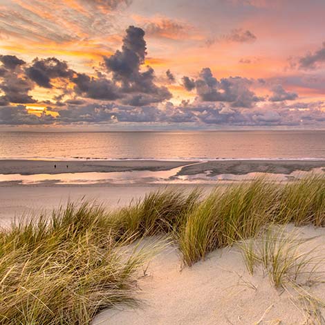 Sunset View from dune over North Sea and Canal in Zeeland, Netherlands