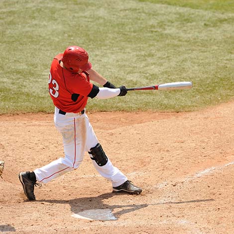 Baseball Batter A Baseball play hits a ball during a game.