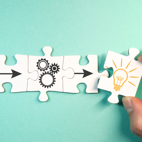 BrianMatthews-WorkWith finding solution for a problem, analysis concept with top view of jigsaw puzzle pieces