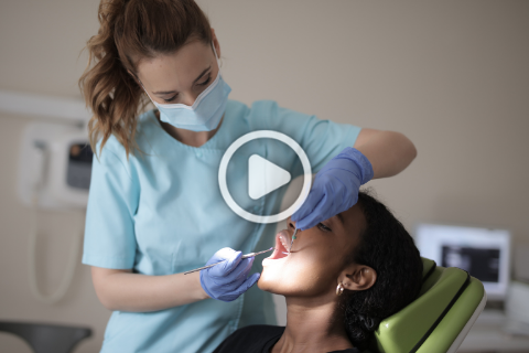 Dental Webinar Cover Image - Female dentist cleaning patients mouth