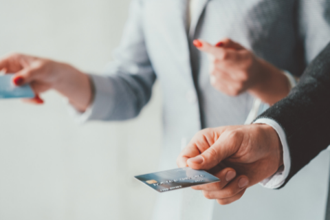 individuals welldressed paying with credit cards