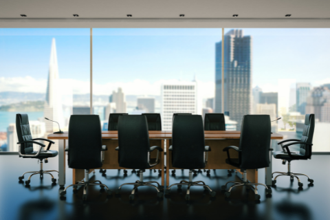 Corporate Boardroom with empty chairs and the San Francisco skyline