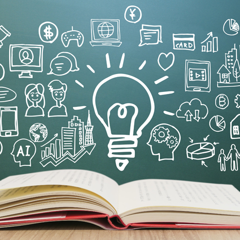 KevinEstep-WorkWIth various blackboard doodles behind an open book