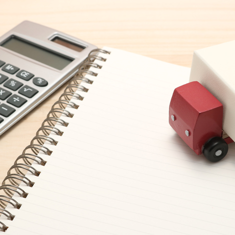 toy truck, calculator, and notepad