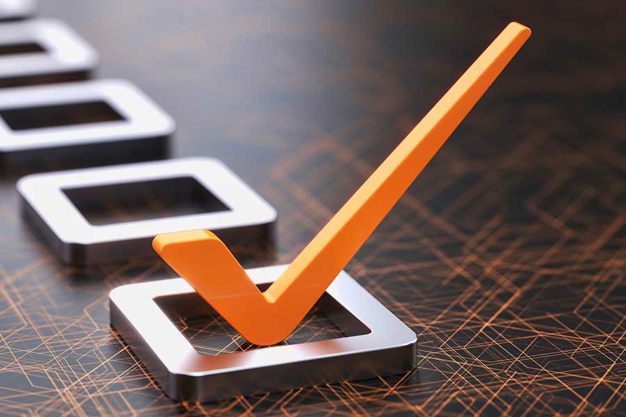 Orange checkmark on wooden table