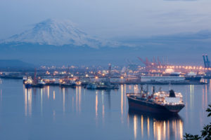 A photo of port Tacoma and a snow topped Mount Rainier