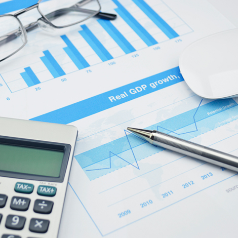 Pen, mouse and glasses on financial chart and graph, accounting background