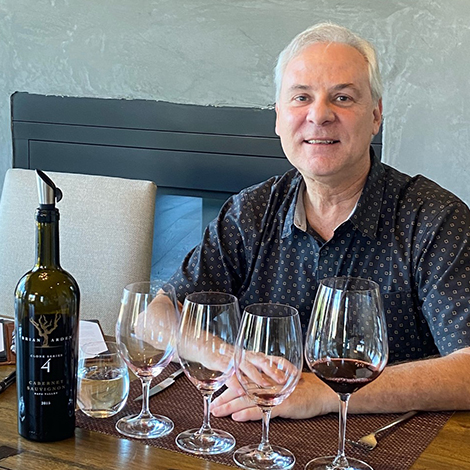 Ed Fahey behind bottles of wine