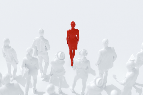 Female figure in red surrounded by other figures in white