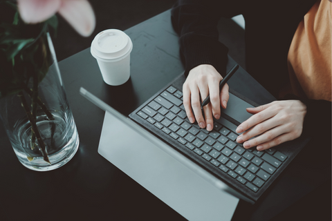 laptop with a coffee cup