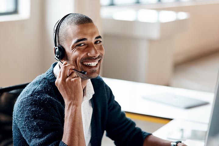 Portrait of a young businessman wearing a headset while working in an office Smart outsource tax team