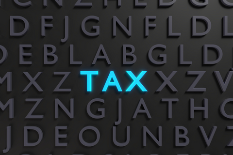 Tax highlighted in blue surrounded by black lettering
