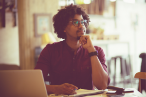 Man in glasses contemplating a decision