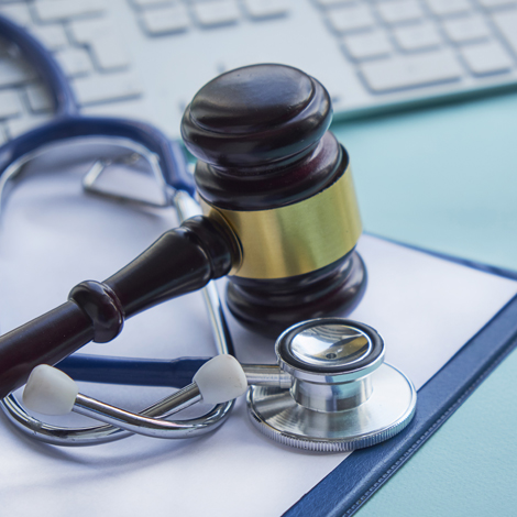 Picture of stethoscope, gavel, and keyboard