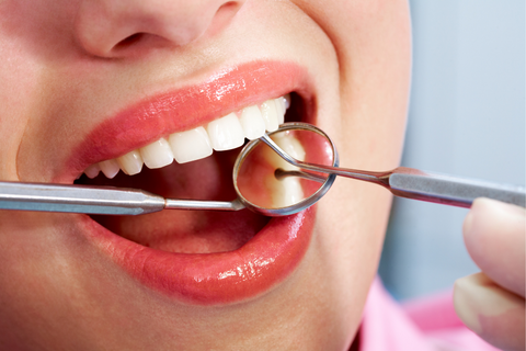 Close up of a smile with dental equipment