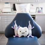 Dental office chair with dental themed stuffed toys