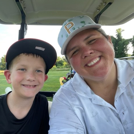 Kayla Kania with her nephew on a golf course