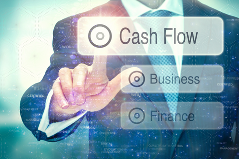 Cash flow digital button with a suited man pressing it