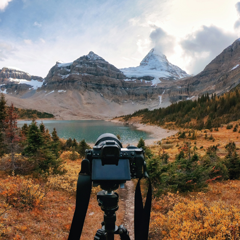 Photo of a camera in front of a landscape