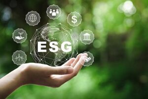 decorativeESG icon concept in the hand for environmental, social, and governance in sustainable and ethical business on the Network connection on a green background.