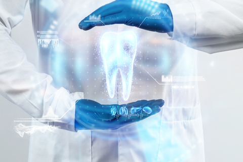 dentist looks at hologram of tooth