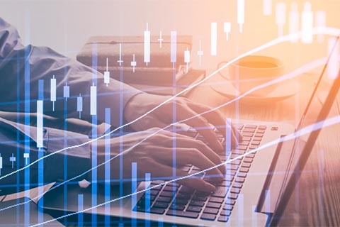 digital illustration of hands typing on computer and an overlay of graph data