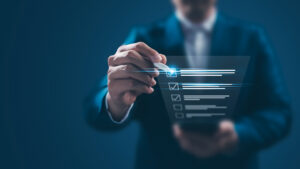 Stock photo of businessman ticking a digital checklist technology finance