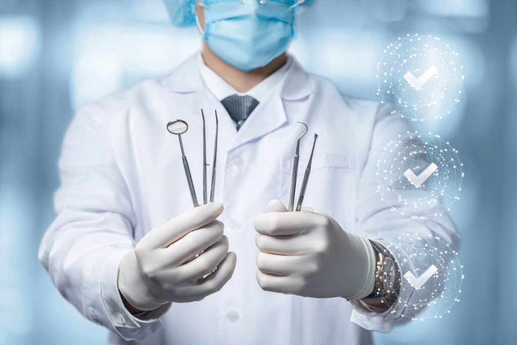 Dentist holding dental tools background image