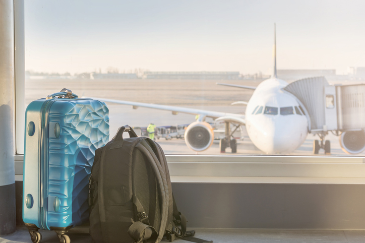 Luggage in front of an airplane at the airport