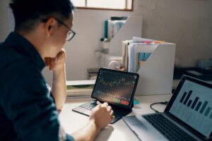Mid adult man working on his personal finance in his home office - stock photo