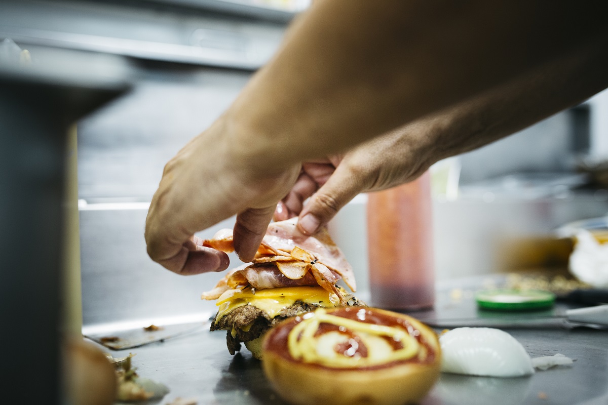 Chef preparing a cheeseburger
