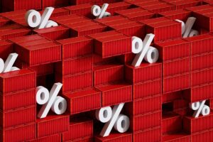 Digital generated image of percent sign embedded in containers in container stack. Economic trade war concept, inflation, tariffs.