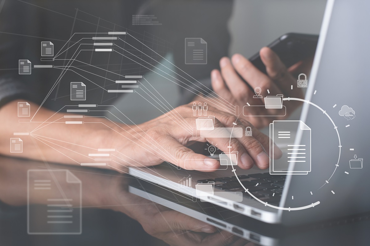 Database directory, E-document, paperless office concept. Business man working on laptop computer with electronic document on virtual screen