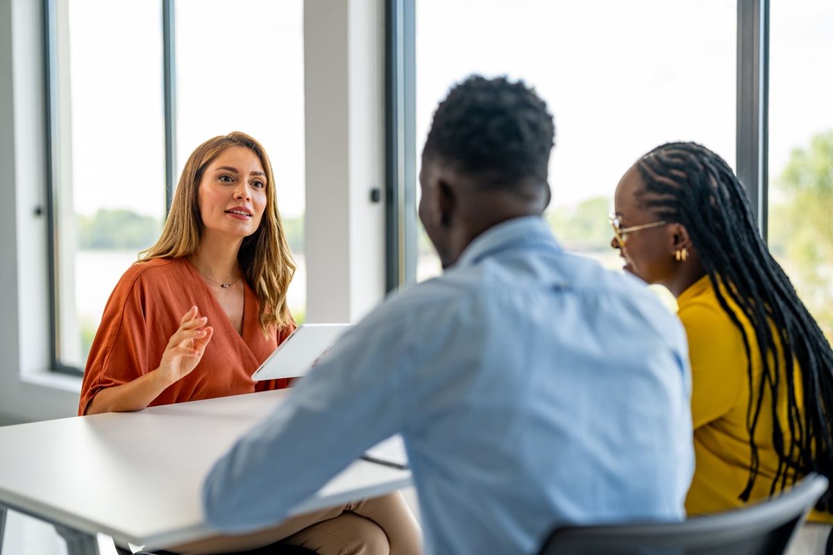 Young ethnic family talking to financial advisor