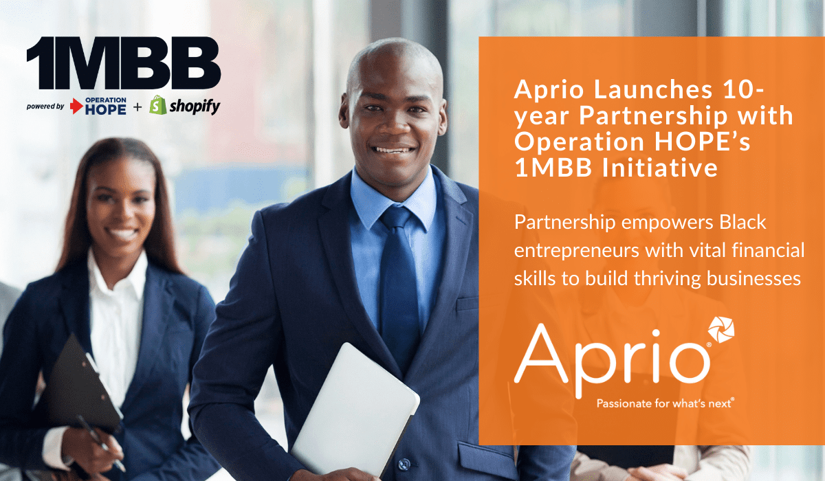 Three professionally dressed people stand together holding laptops and folders. Text announces Aprios 10-year partnership with Operation HOPEs 1MBB initiative to support Black entrepreneurs.