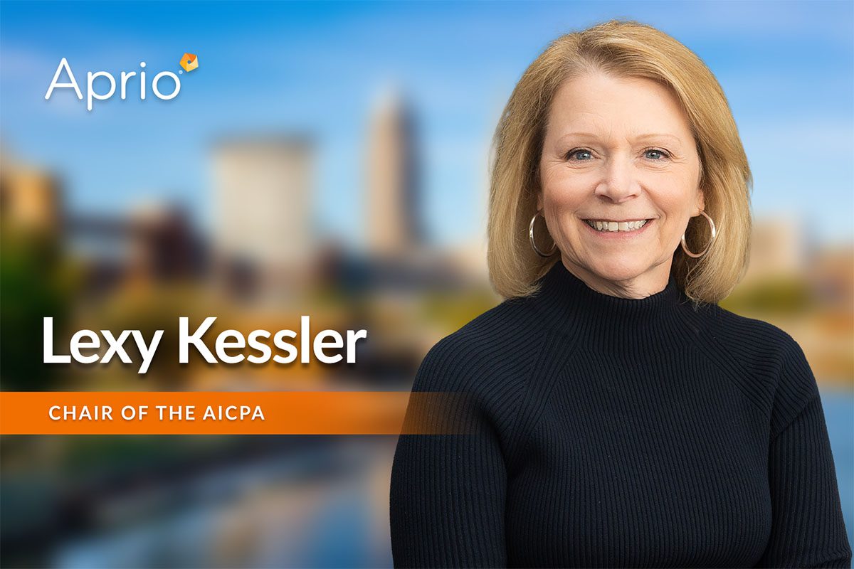 A woman with blonde hair wearing a black top smiles at the camera. Text reads: Lexy Kessler, Chair of the AICPA with the Aprio logo in the top left corner.
